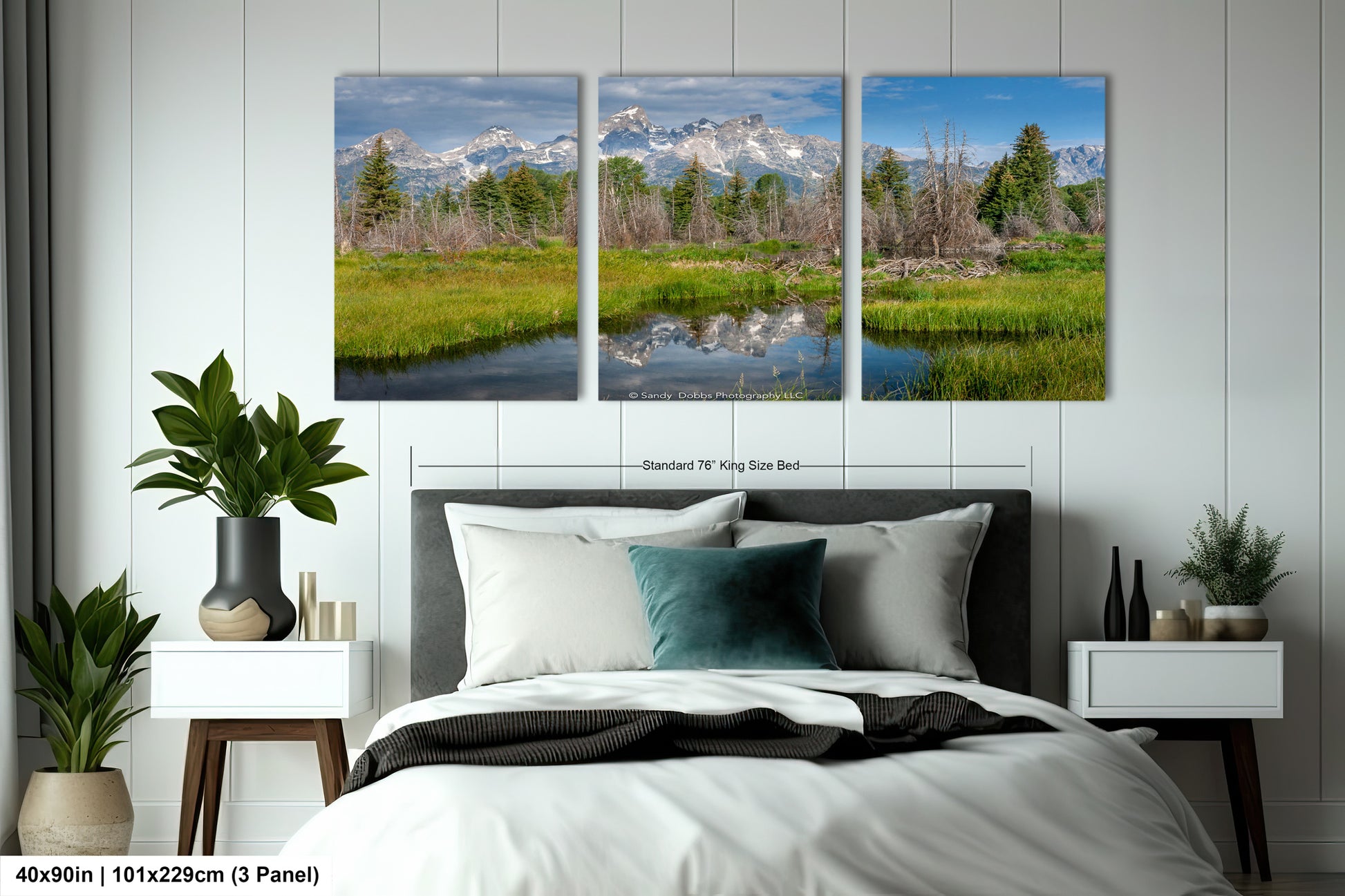 a bed room with a neatly made bed and two pictures on the wall