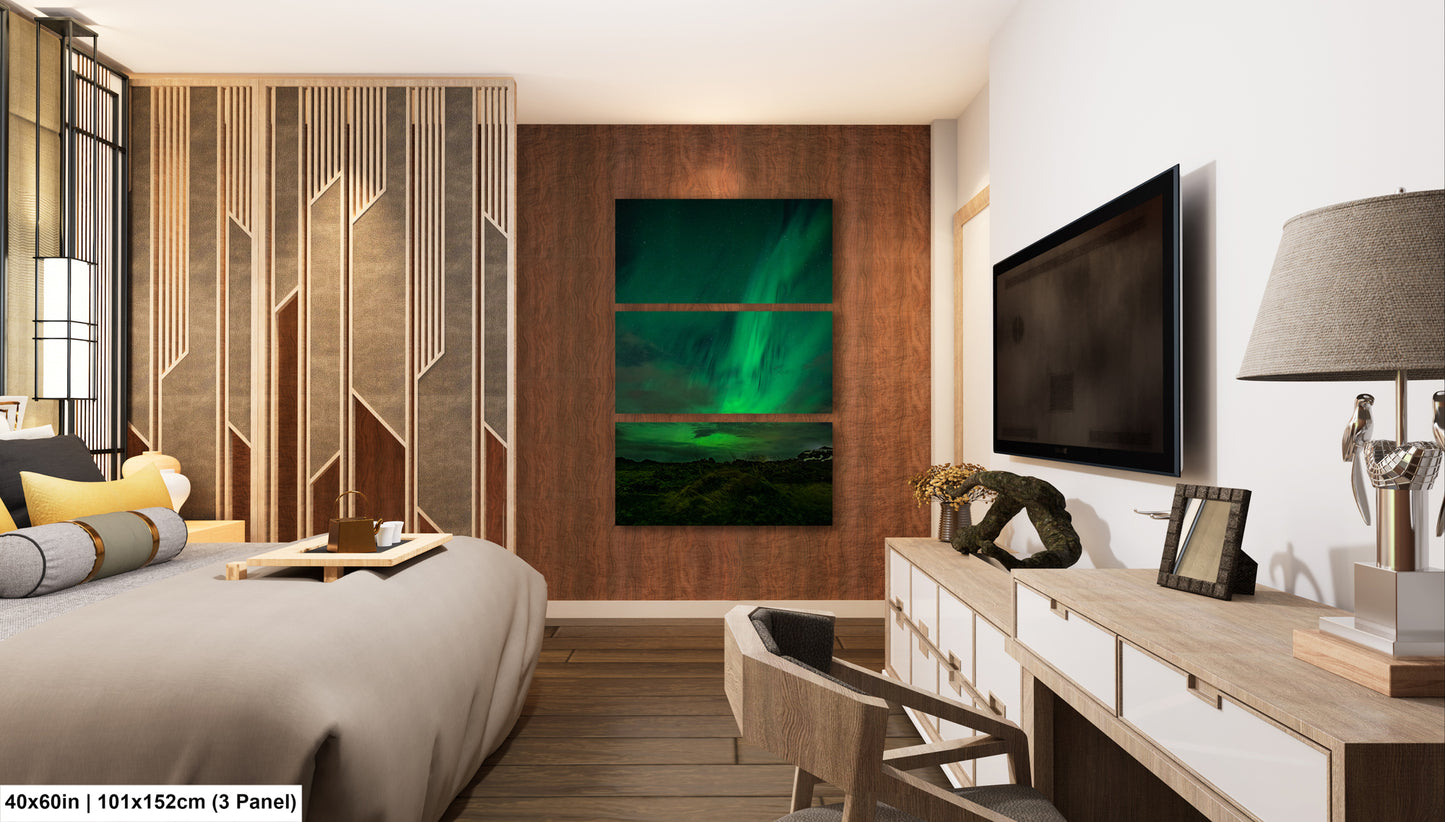 a modern bedroom with a large bed, a wooden dresser, and a television mounted on the wall. The room has a minimalist and contemporary design, with a focus on natural elements such as the wooden wall panel and the large painting depicting the Aurora Borealis.