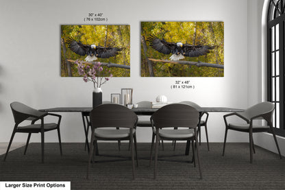 a dining room table with four chairs and two pictures of an eagle on the wall