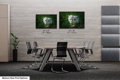 a dining room table with chairs and two pictures on the wall