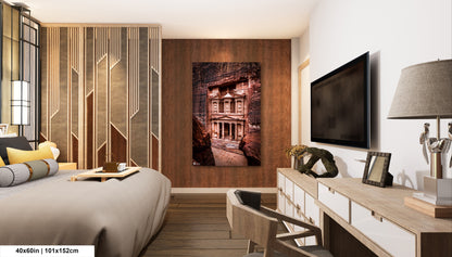 a bed room with a neatly made bed and a flat screen tv