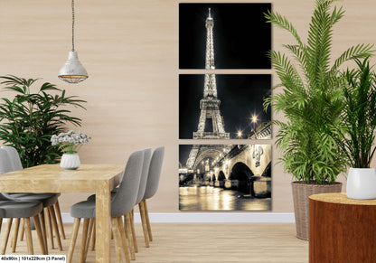 a dining room with a table and chairs and a picture of the eiffel