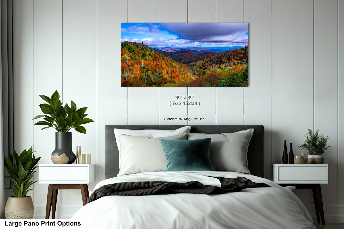 a bedroom with a large bed and a painting on the wall