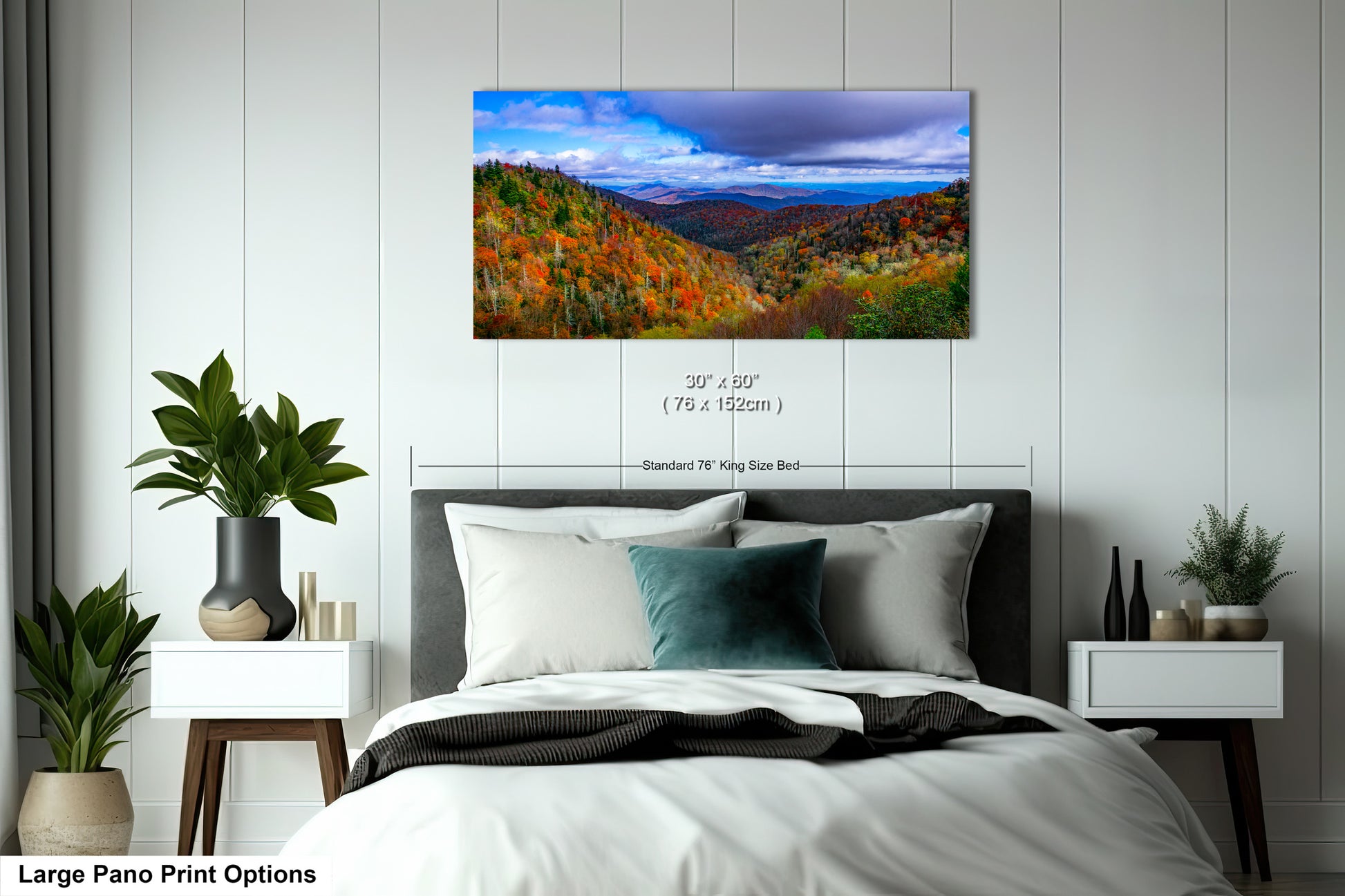 a bedroom with a large bed and a painting on the wall