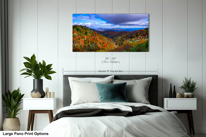 a bedroom with a large bed and a painting on the wall