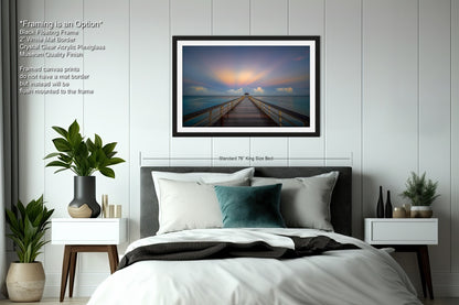 a bedroom with a bed and a picture on the wall