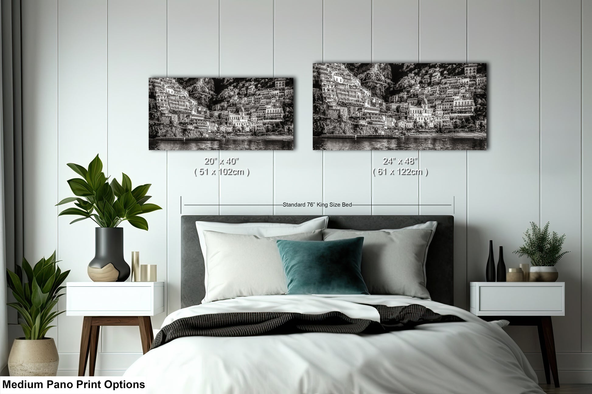 a bed with a white comforter and two black and white pictures on the wall