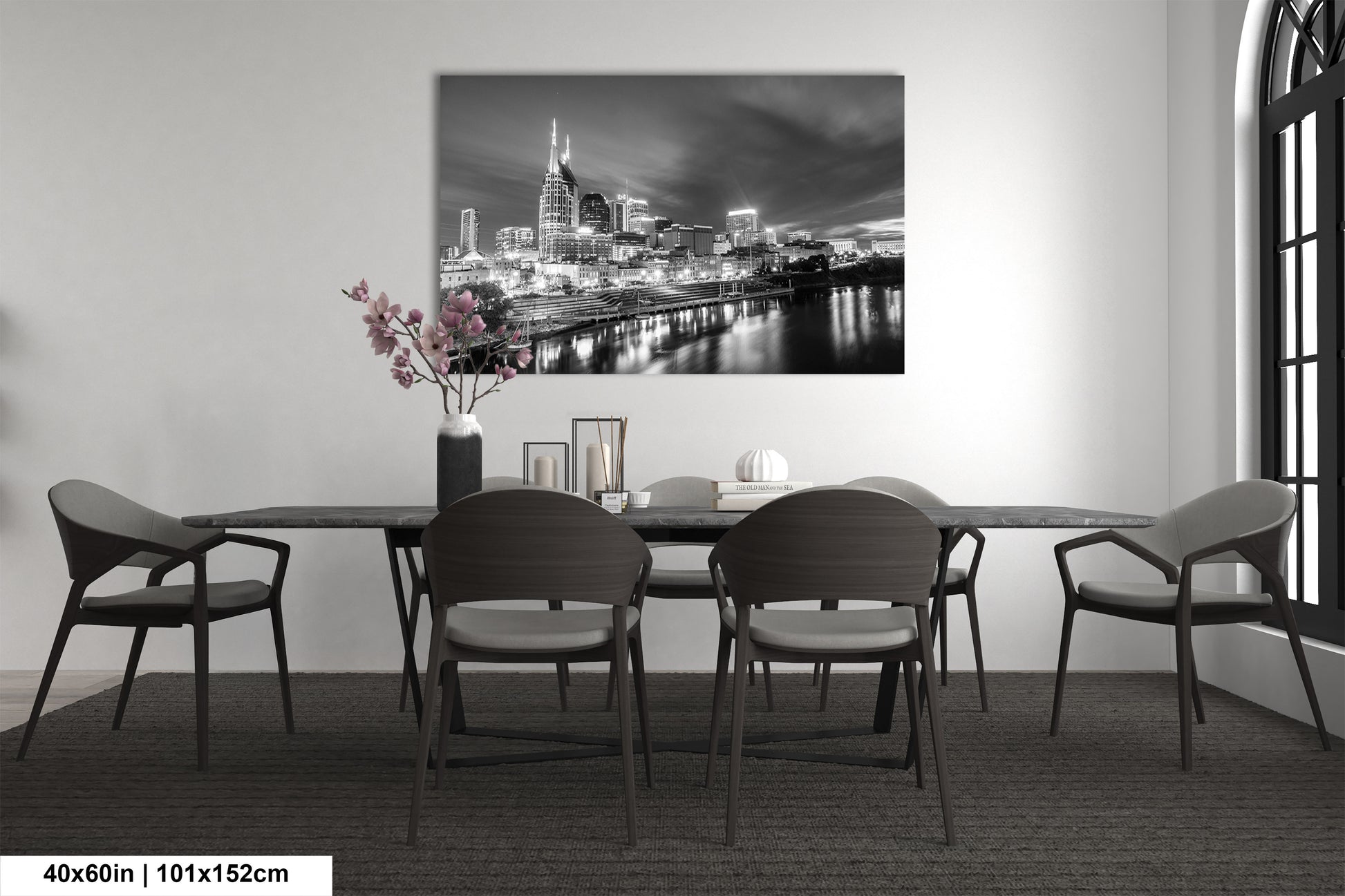 a black and white photo of a dining room table