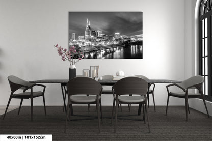 a black and white photo of a dining room table