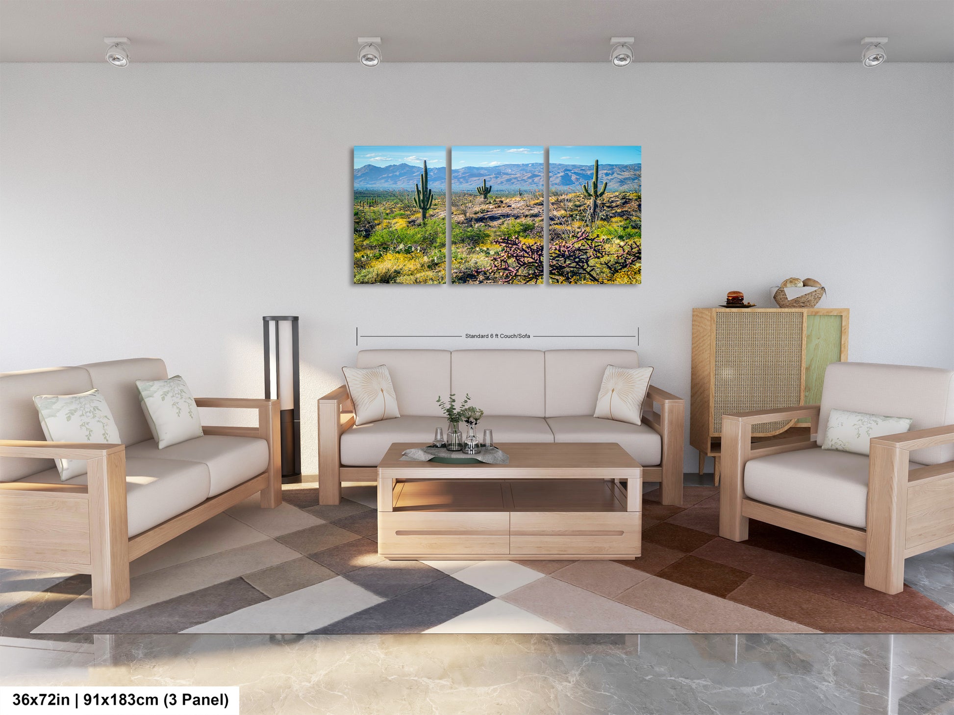A modern living room with a large, three-panel landscape painting depicting a desert scene with mountains in the background. The room is furnished with a sofa, two armchairs, and a coffee table, creating a comfortable and inviting atmosphere.