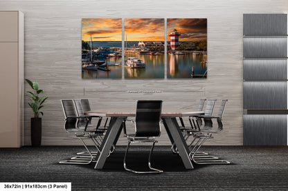 a dining room table with chairs and a painting on the wall