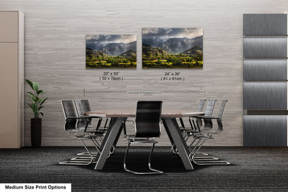 a dining room table with chairs and two pictures on the wall