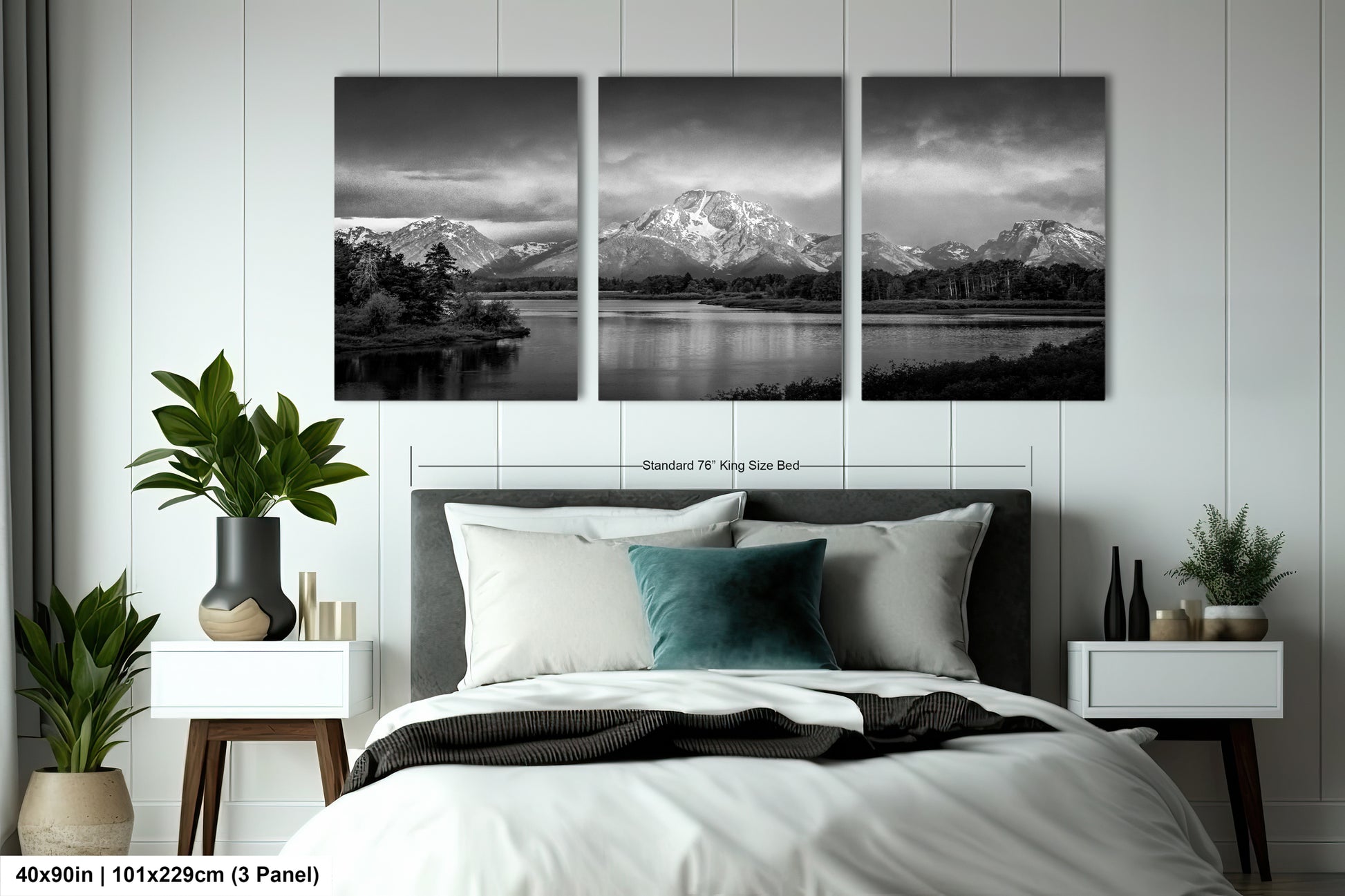 a black and white photo of a bed with a mountain range in the background