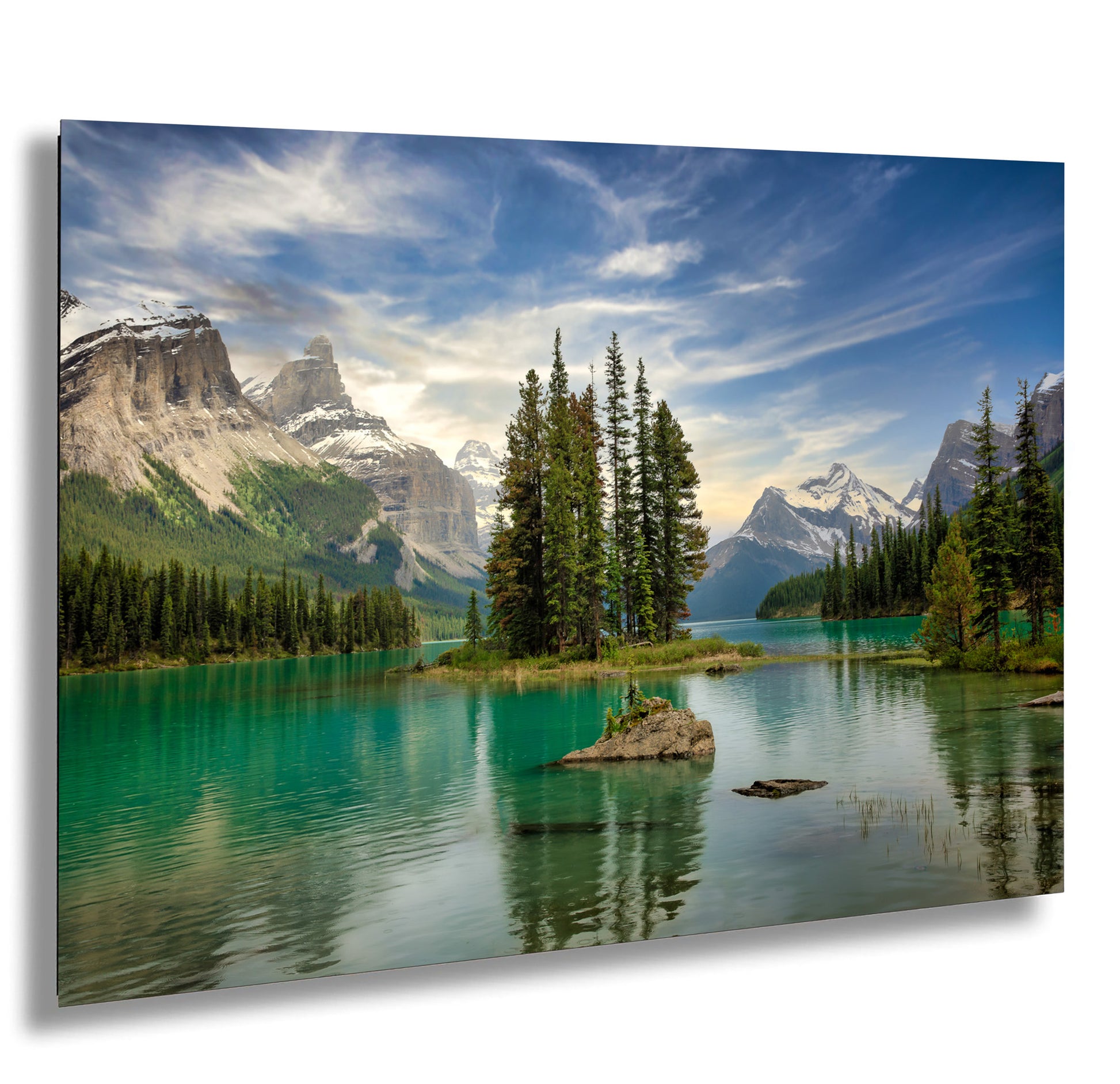 a lake surrounded by trees and mountains under a cloudy sky