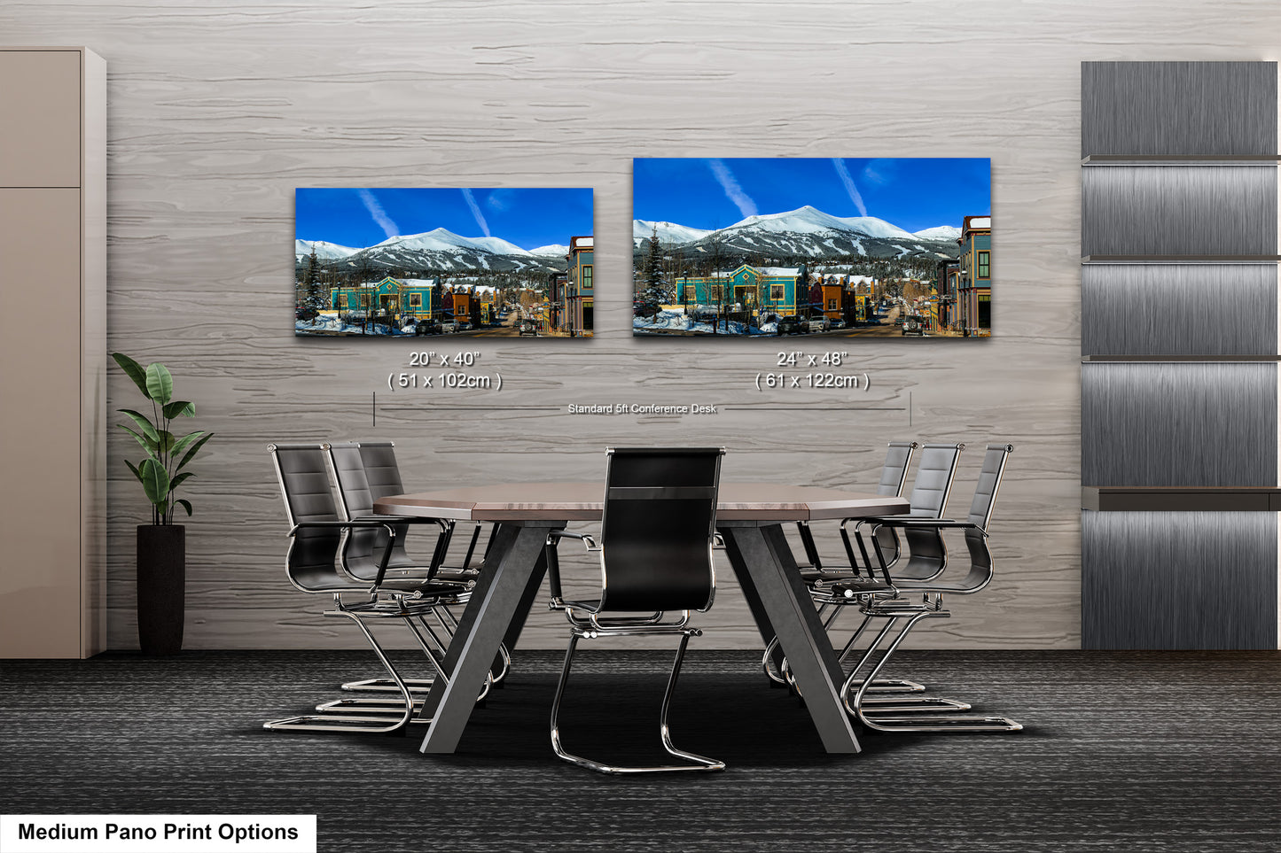 a dining room table with chairs and two pictures on the wall