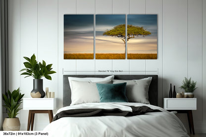 a bedroom with a bed and two paintings on the wall
