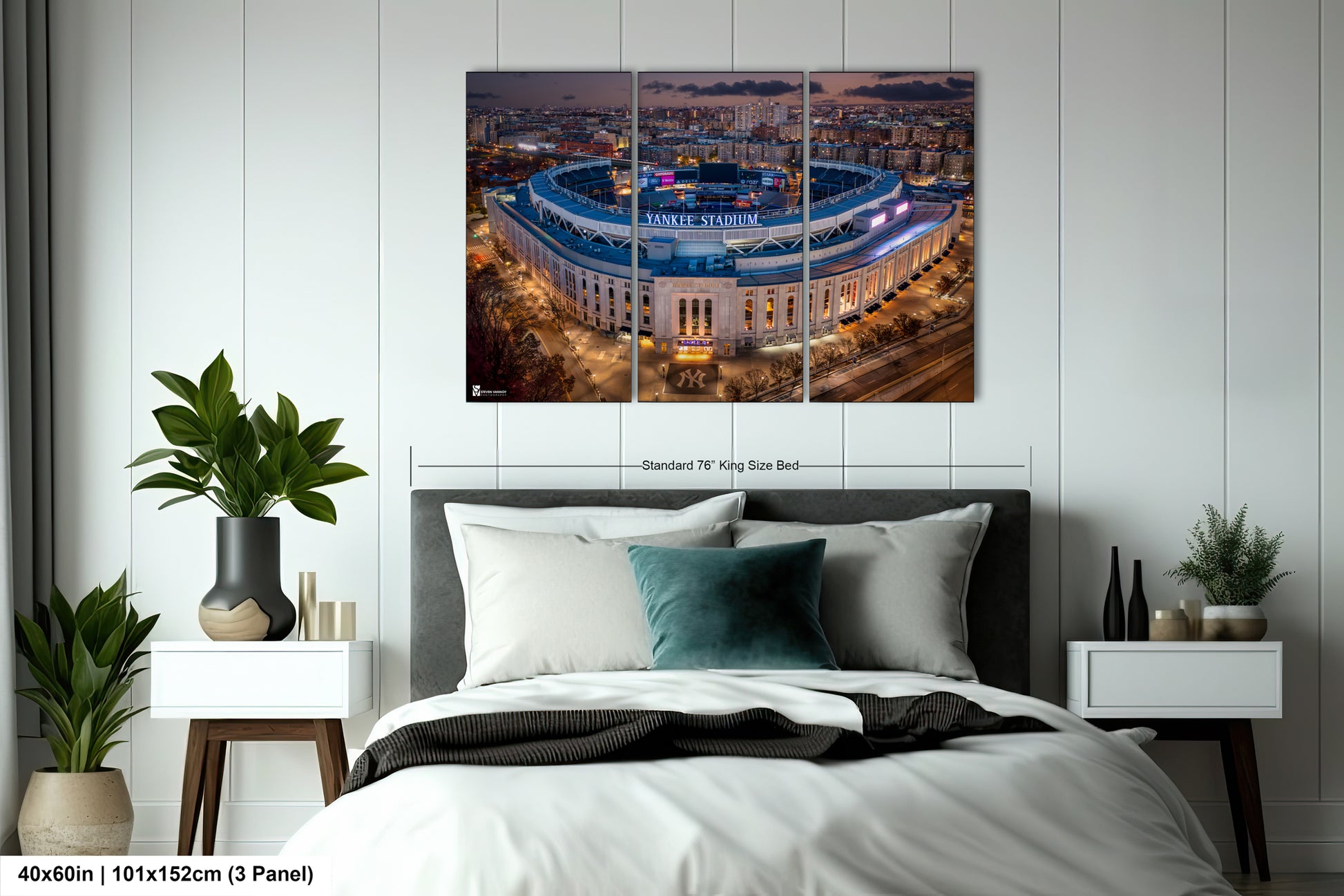 a bedroom with a large bed and a picture on the wall