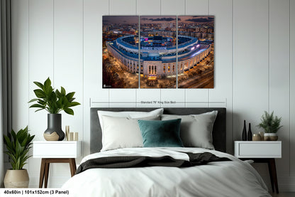 a bedroom with a large bed and a picture on the wall