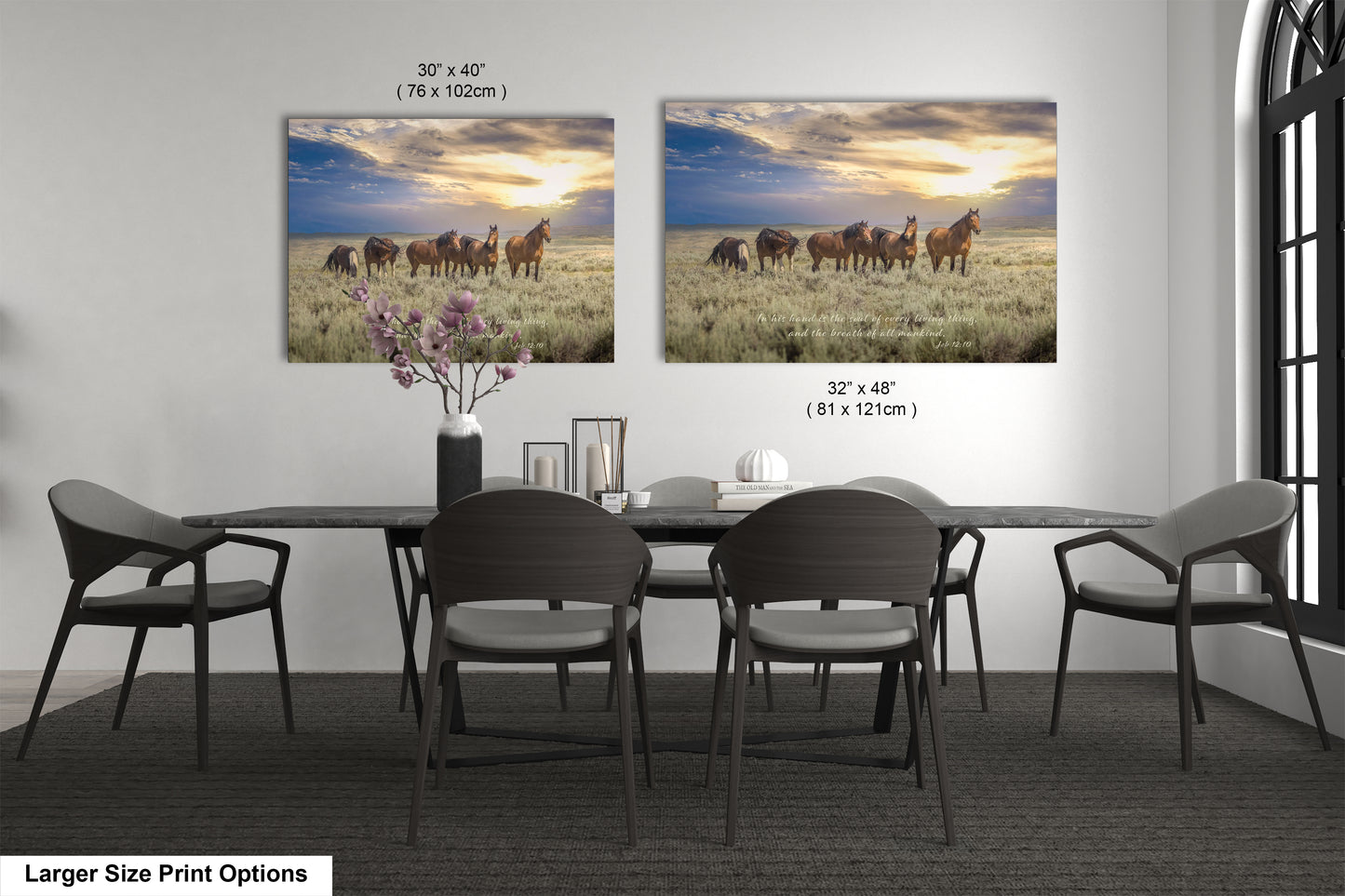 a dining room table with four chairs and two pictures of horses on the wall