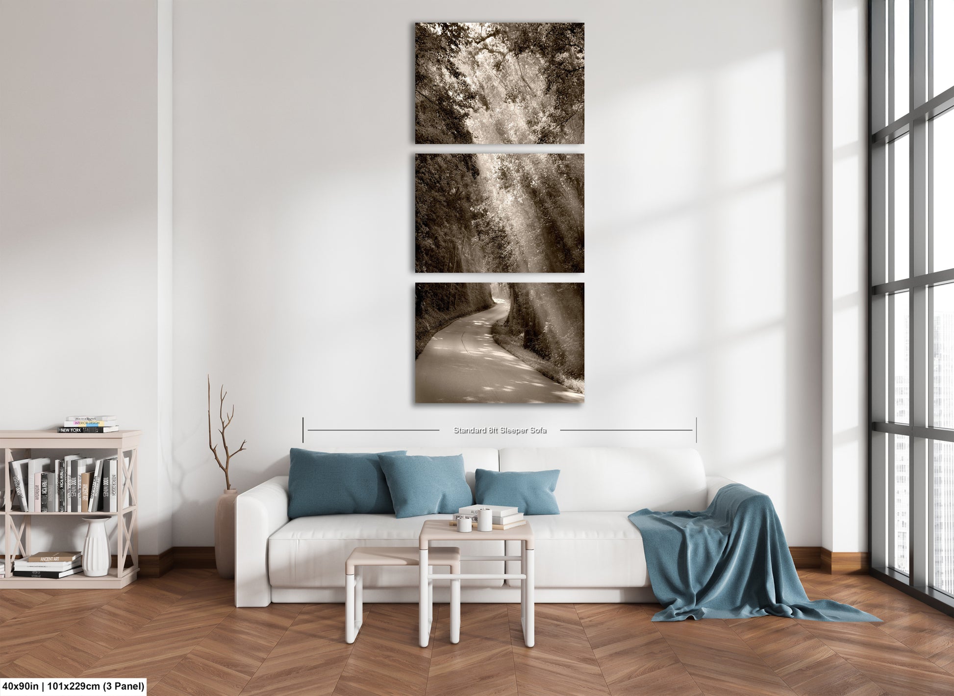 a living room with a white couch and three pictures on the wall