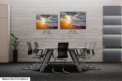 a dining room table with chairs and two pictures on the wall
