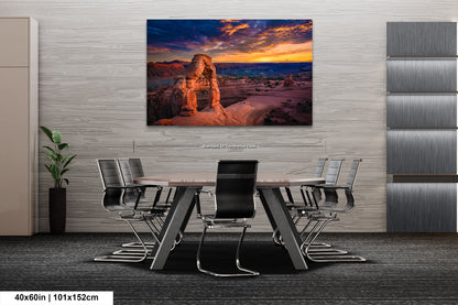 a painting of a woman standing on a rock in the desert