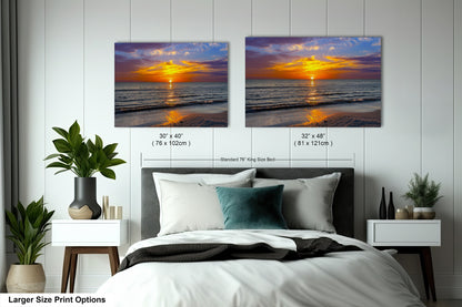 a bedroom with a bed and two pictures on the wall