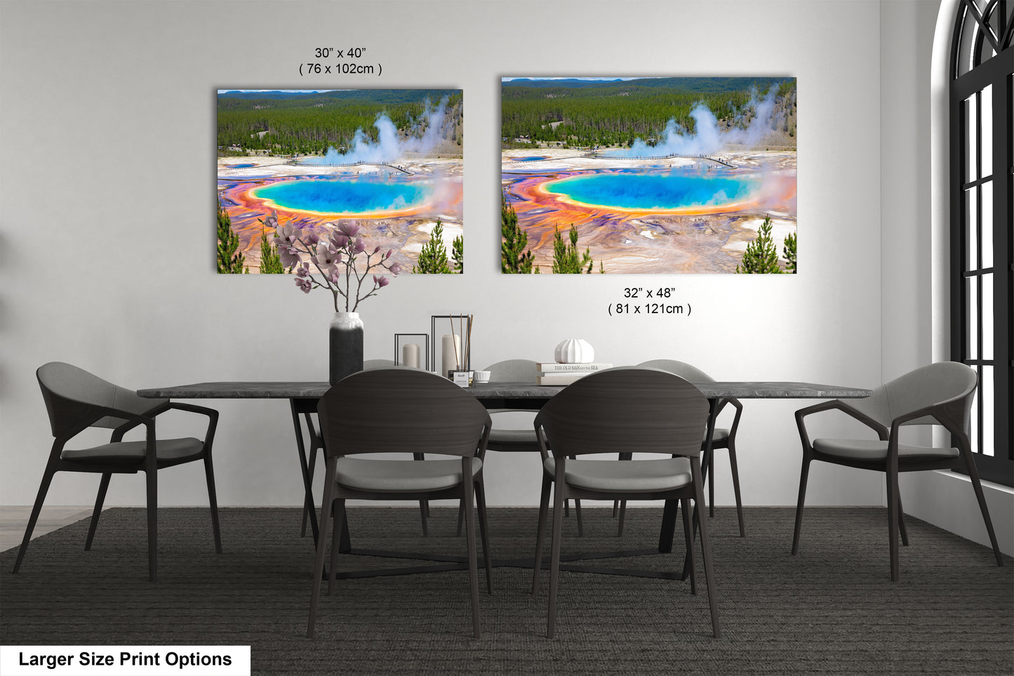 a dining room table with four chairs and a large picture of a geyser