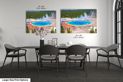 a dining room table with four chairs and a large picture of a geyser