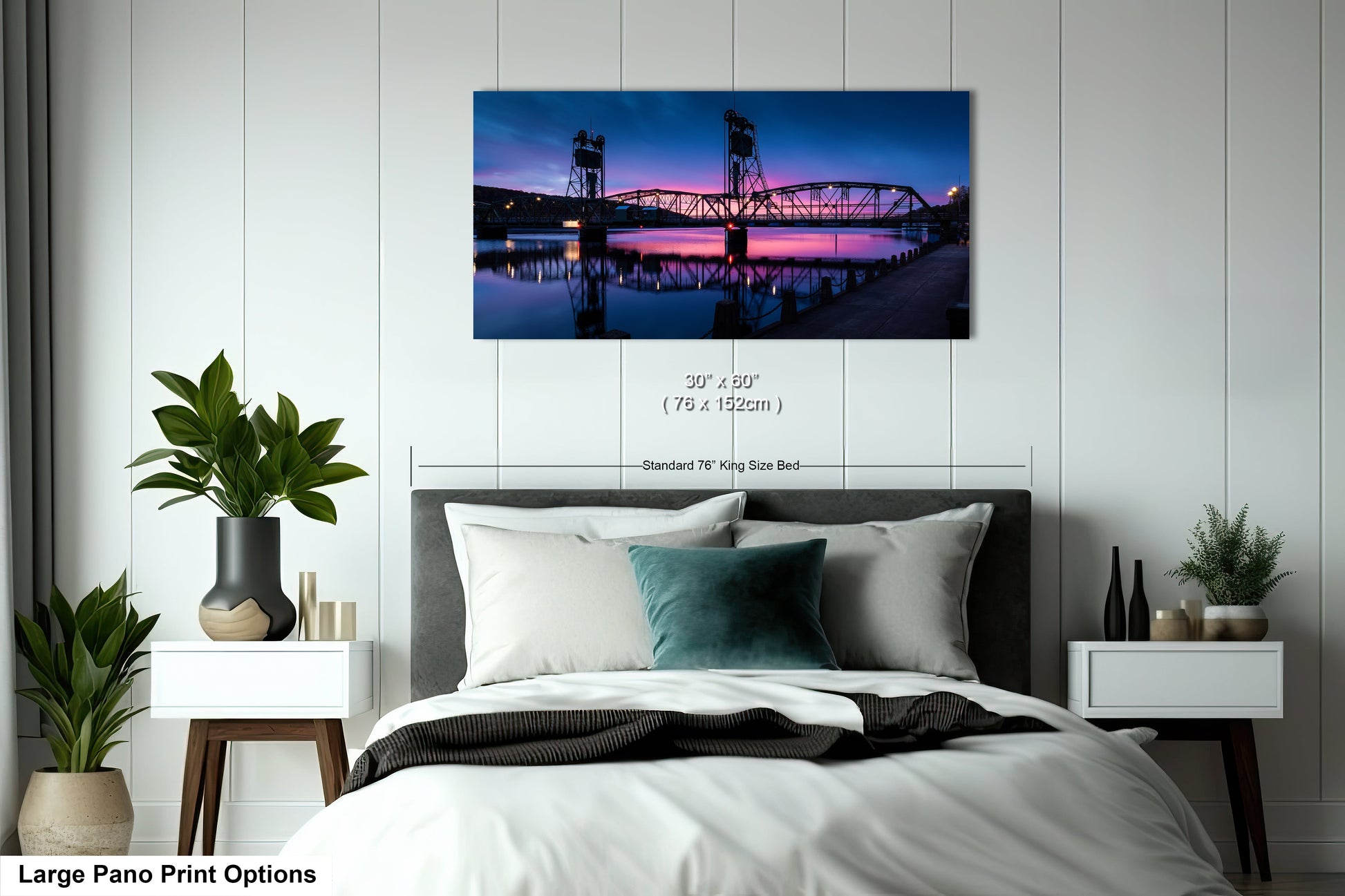 a bedroom with a large bed and a painting on the wall