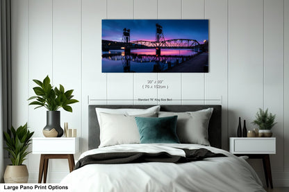 a bedroom with a large bed and a painting on the wall