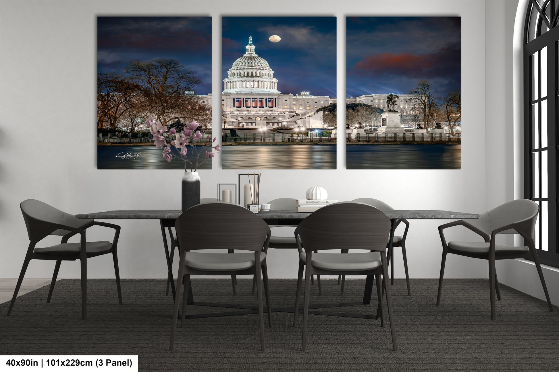 a dining room table with four chairs and a picture of the capitol building