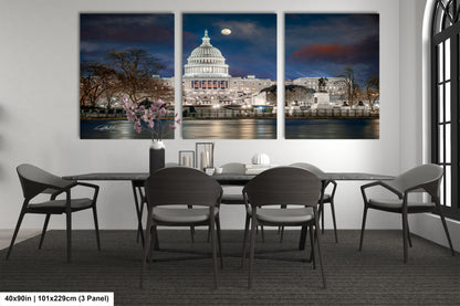 a dining room table with four chairs and a picture of the capitol building