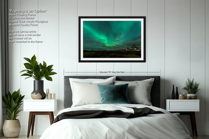 a bedroom with a large bed and a green aurora bore