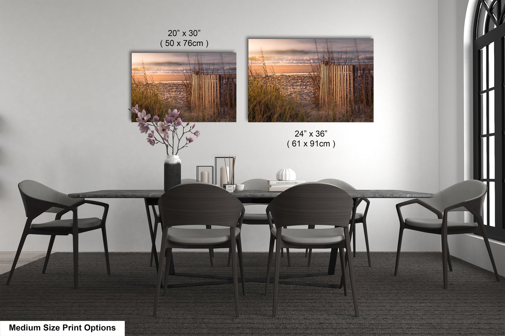 a dining table with four chairs and a vase of flowers