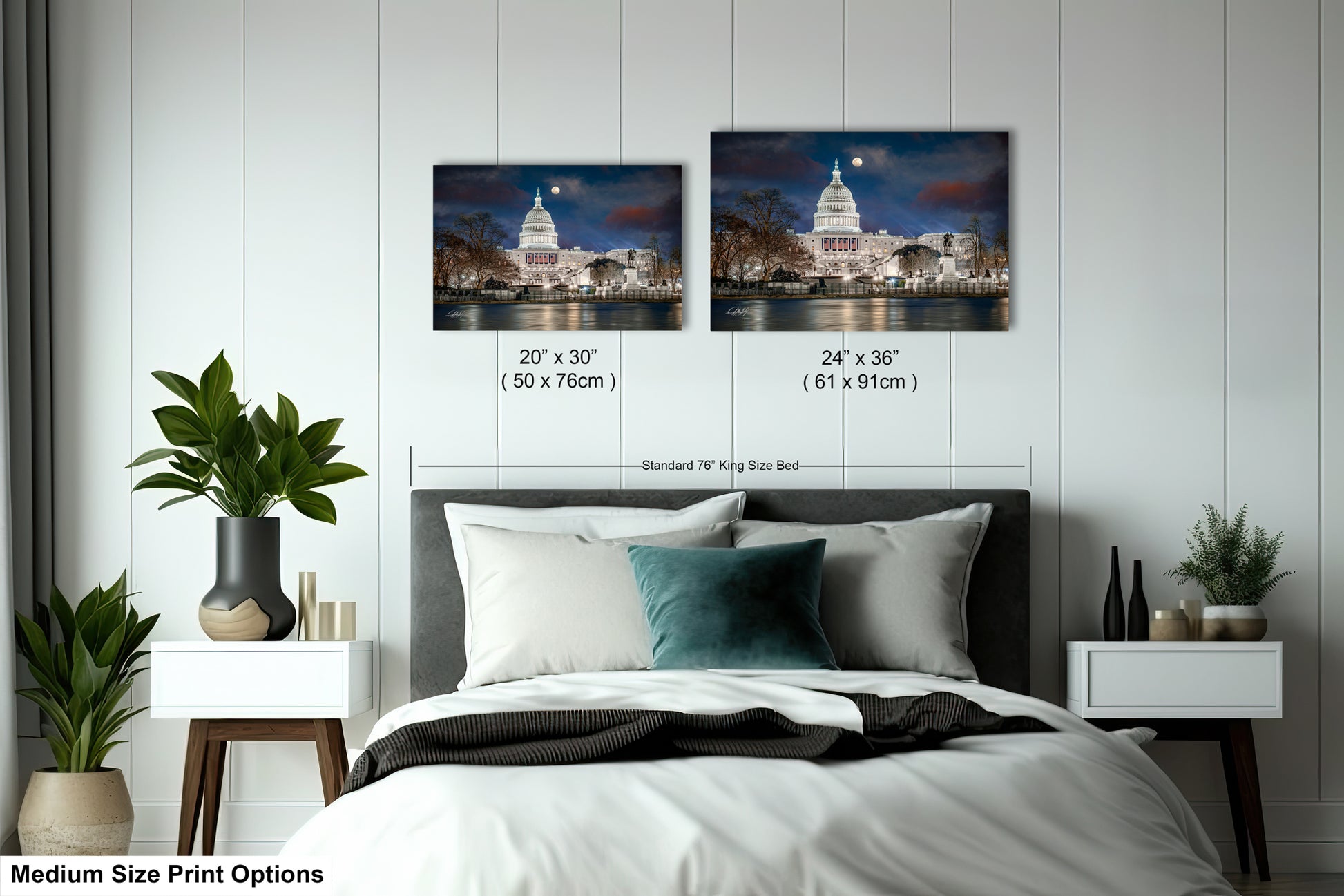 a bed with a white comforter and two pictures on the wall