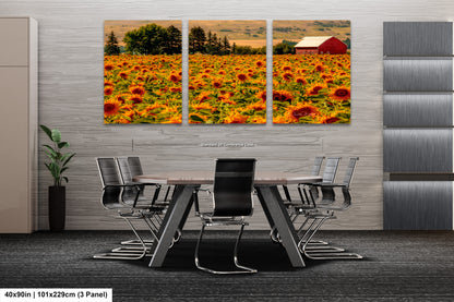 a dining room table with chairs in front of a large sunflower field