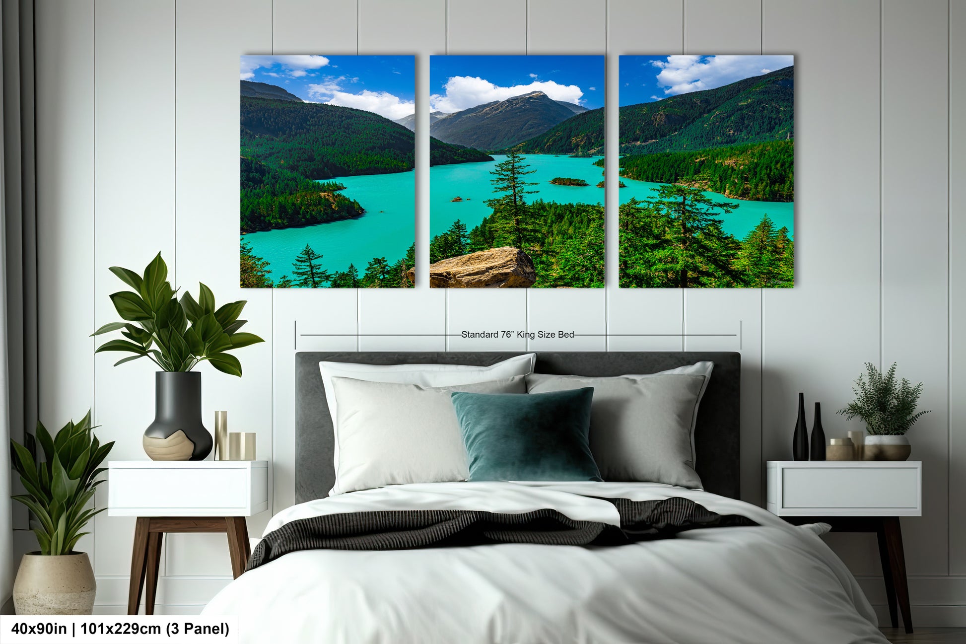 The image is a large bedroom with a bed, nightstands, and a large wall art depicting a scenic landscape with mountains, a lake, and trees.