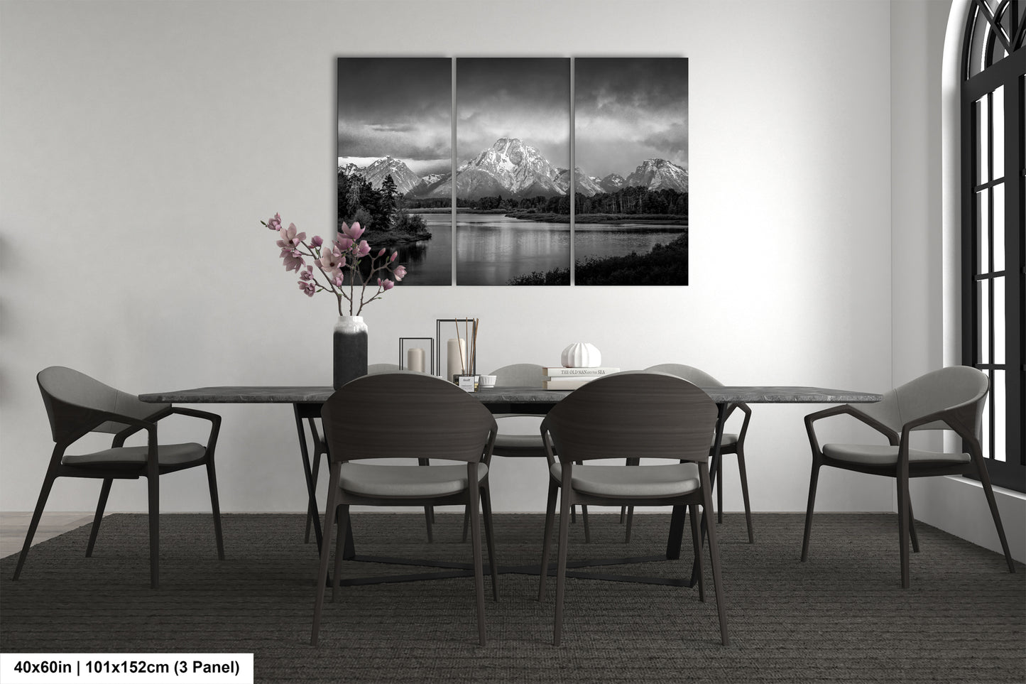 a black and white photo of a dining room table