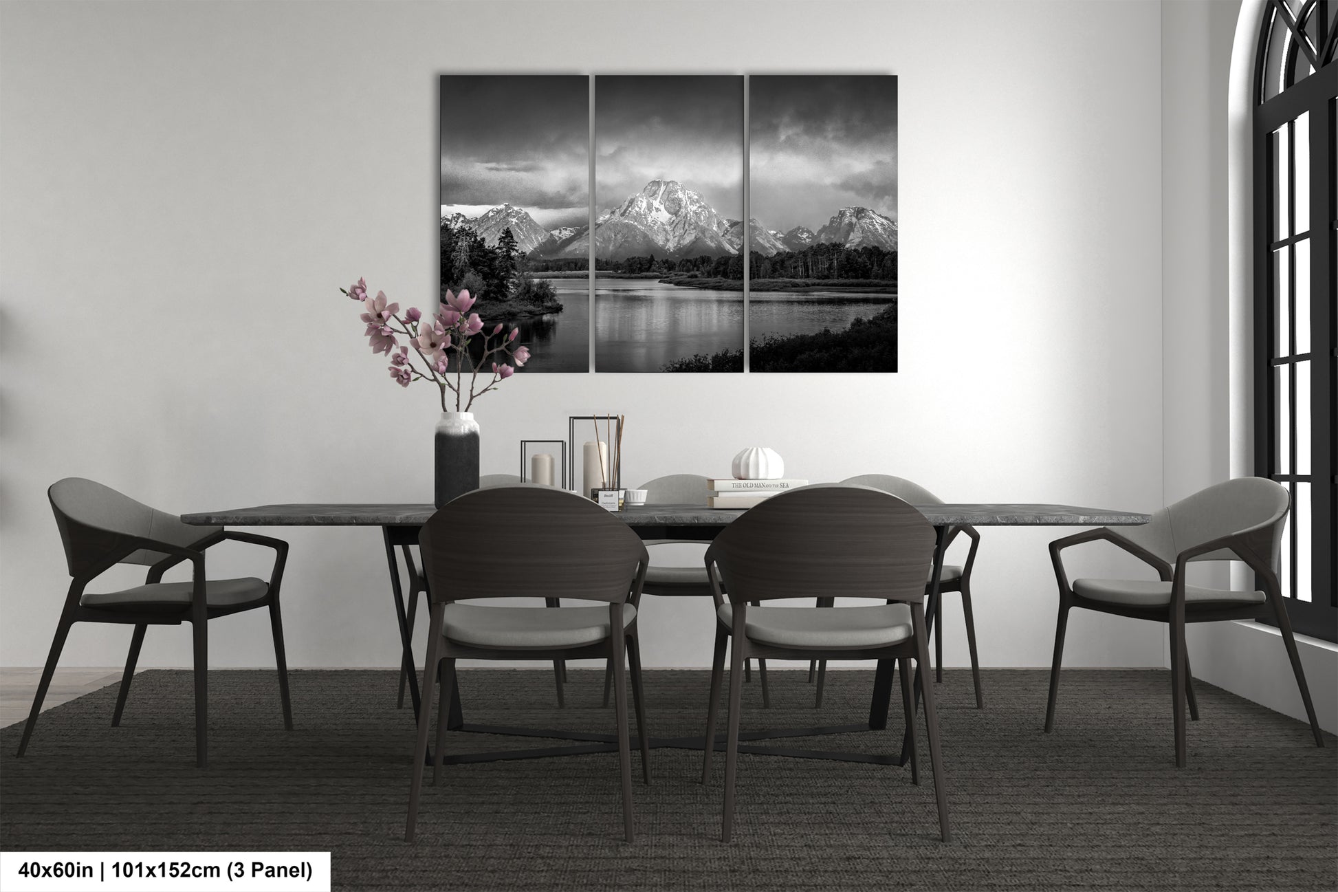 a black and white photo of a dining room table