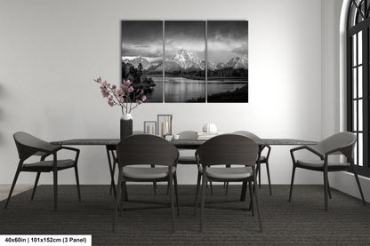 a black and white photo of a dining room table