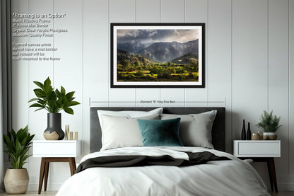 a bedroom with a bed and a picture on the wall