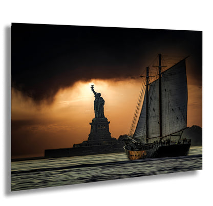 the statue of liberty is silhouetted against a cloudy sky