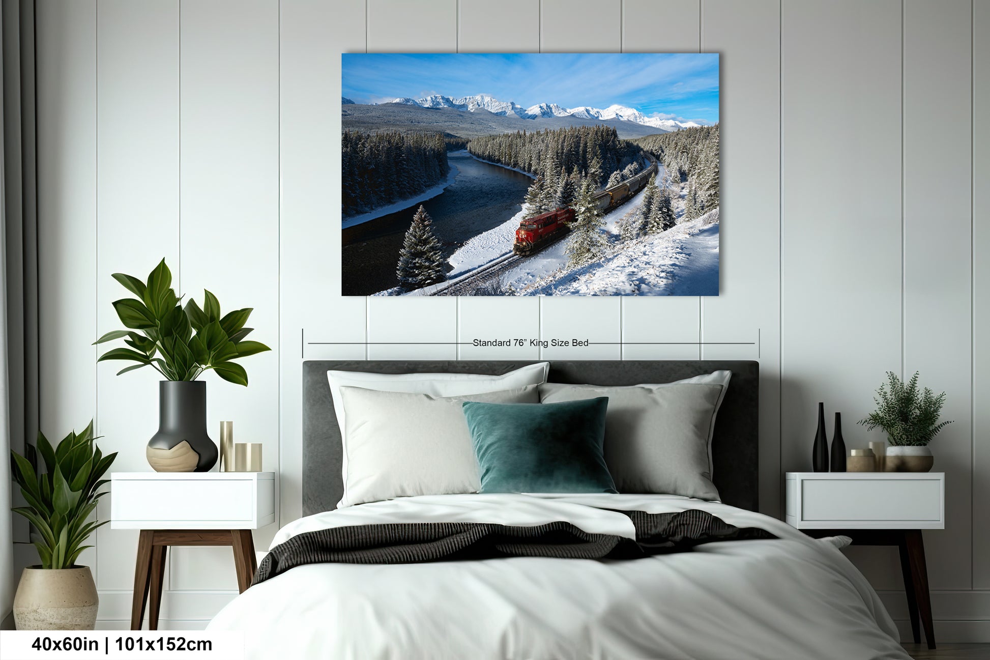 a snowy mountain landscape with a train traveling through it.