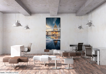 a room with chairs, desks and a painting on the wall
