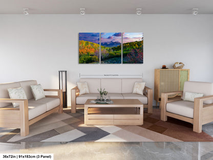a living room filled with furniture and a painting on the wall