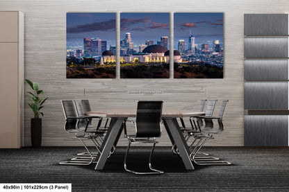 a dining room table with a view of a city at night