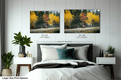 a bedroom with a bed and two pictures on the wall