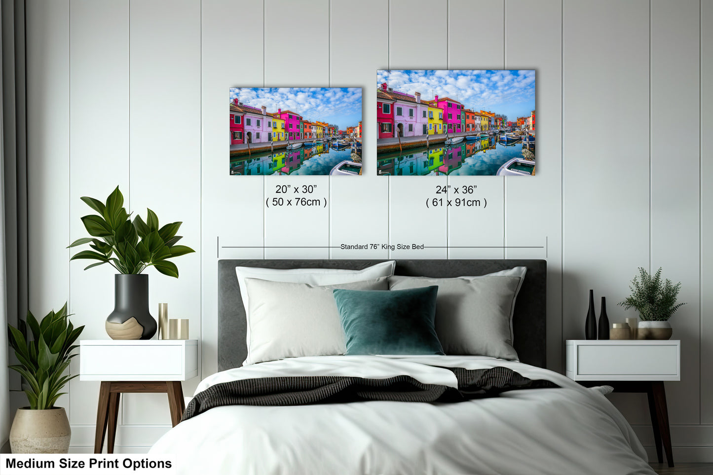 a bed room with a neatly made bed and two paintings on the wall