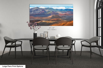 a large pano print depicting a scenic landscape with mountains, valleys, and a desert-like terrain.